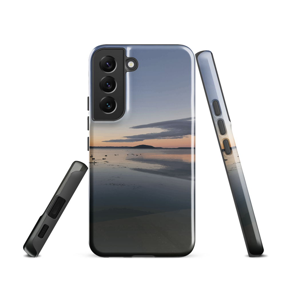 Phone case with tranquil lake scene at sunrise and distant hills.