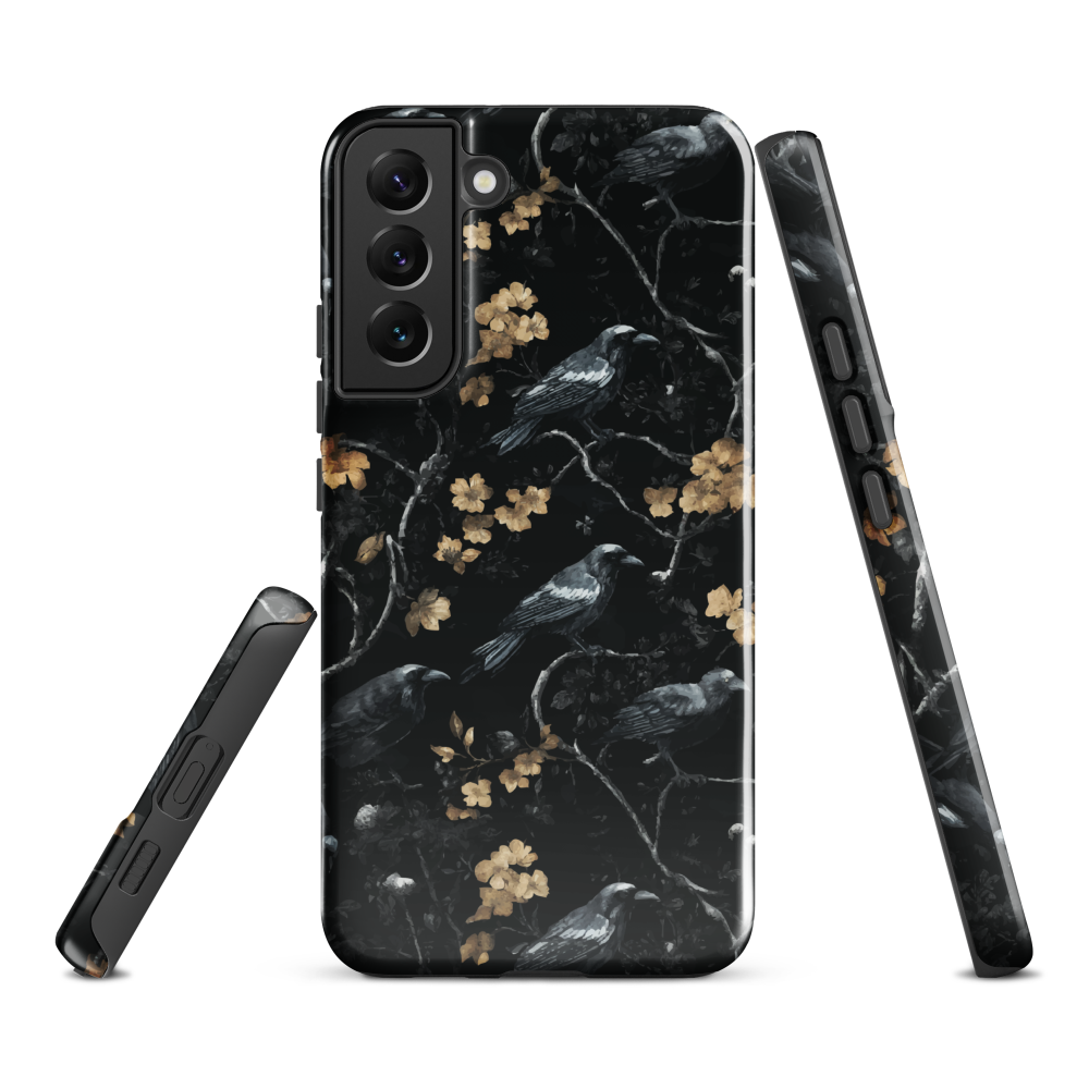 Dark phone case with blackbirds and gold blossoms on black branches.