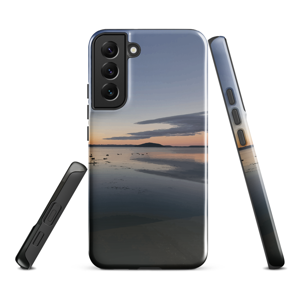 Phone case with tranquil lake scene at sunrise and distant hills.