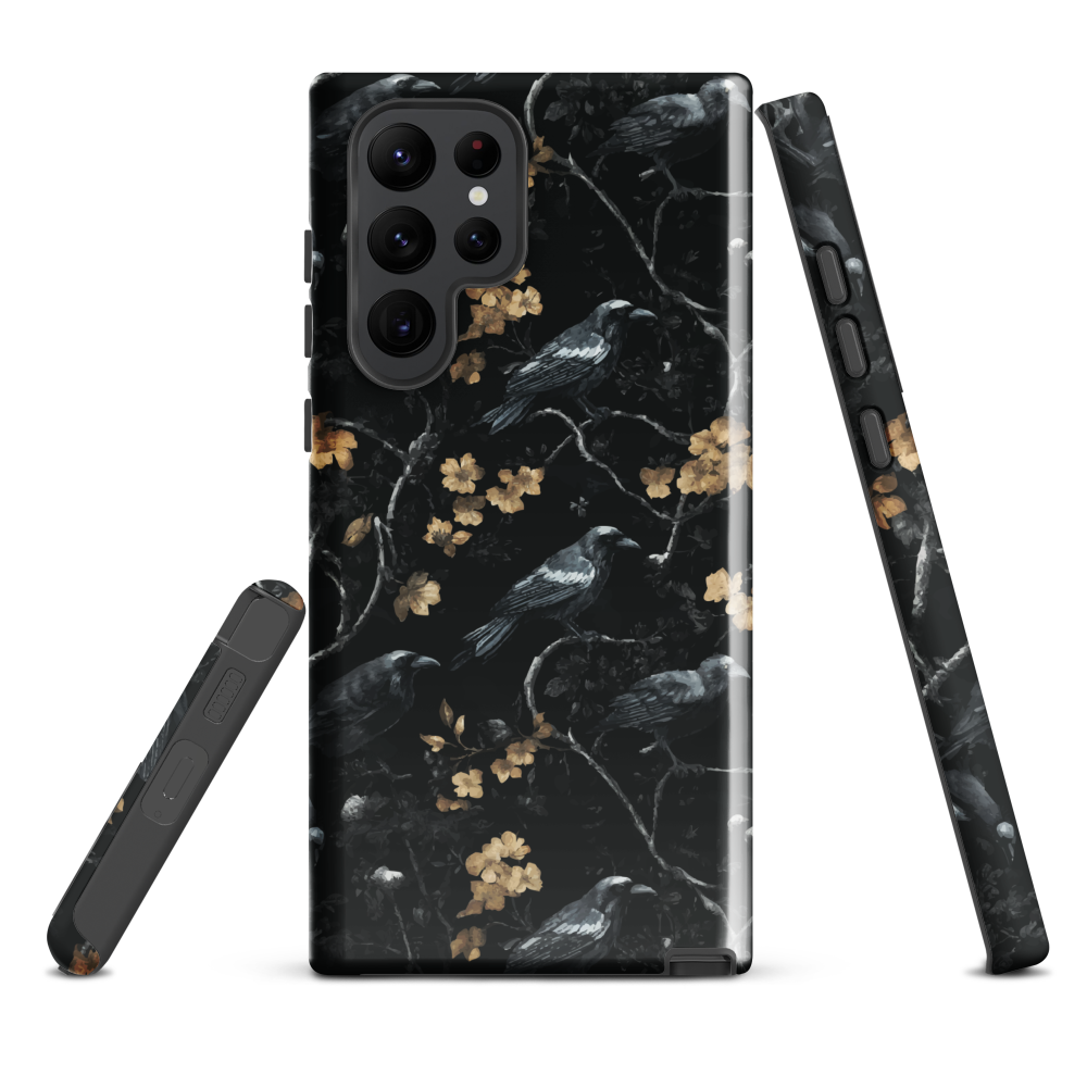 Dark phone case with blackbirds and gold blossoms on black branches.