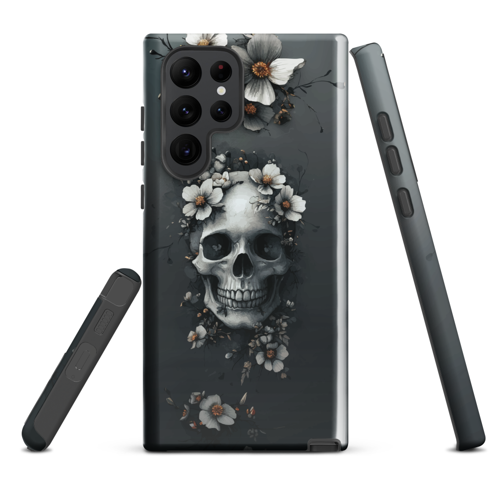 Gothic phone case with a floral skull design in grey tones, featuring white blossoms and dark detailing.