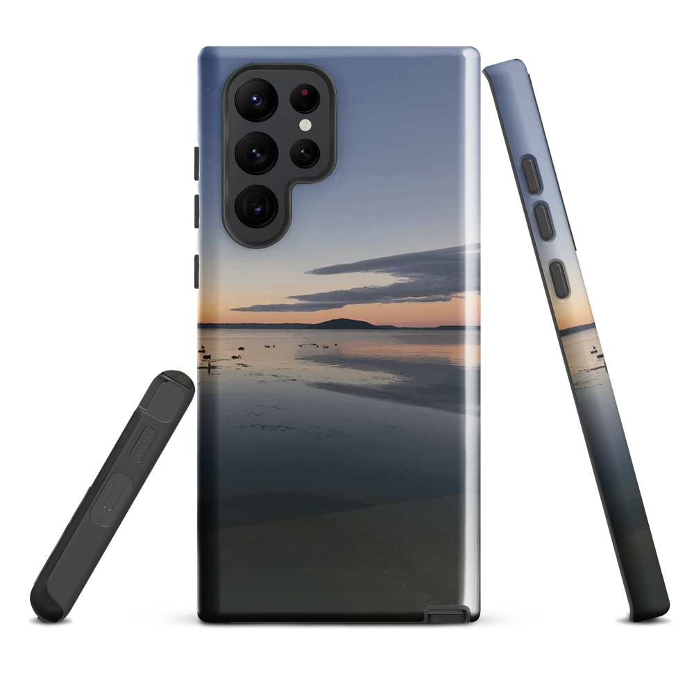 Phone case with tranquil lake scene at sunrise and distant hills.