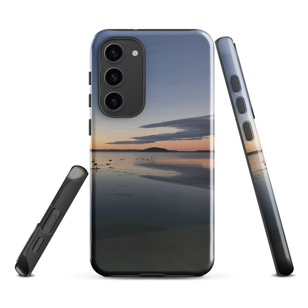 Phone case with tranquil lake scene at sunrise and distant hills.