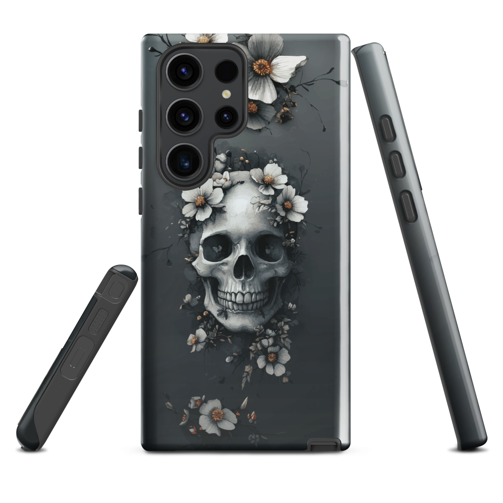 Gothic phone case with a floral skull design in grey tones, featuring white blossoms and dark detailing.