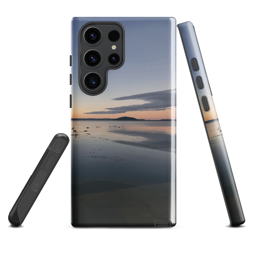 Phone case with tranquil lake scene at sunrise and distant hills.