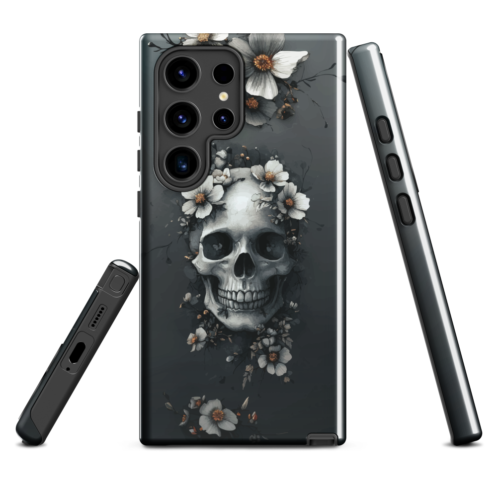 Gothic phone case with a floral skull design in grey tones, featuring white blossoms and dark detailing.