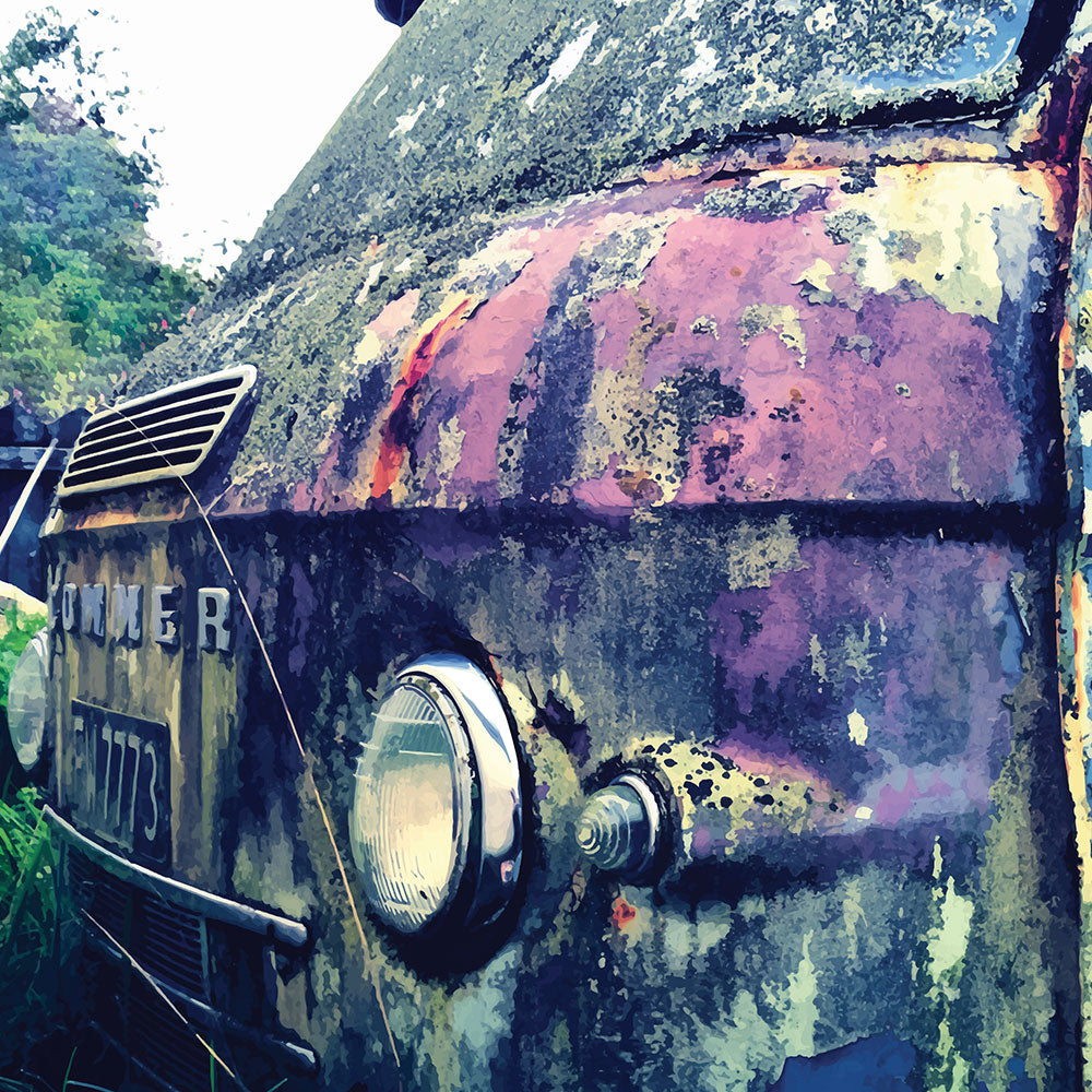 Close-up of a rusted vintage Commer van with textured patina in purple, green and chrome.