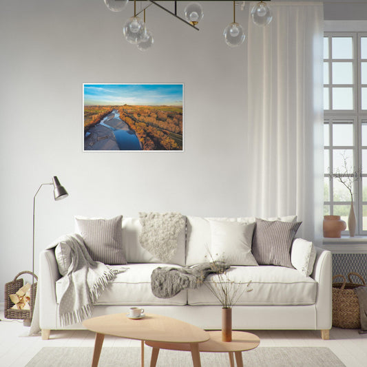 Aerial artwork of the Tukituki River winding through farmland, glowing in golden light with blue water reflections.