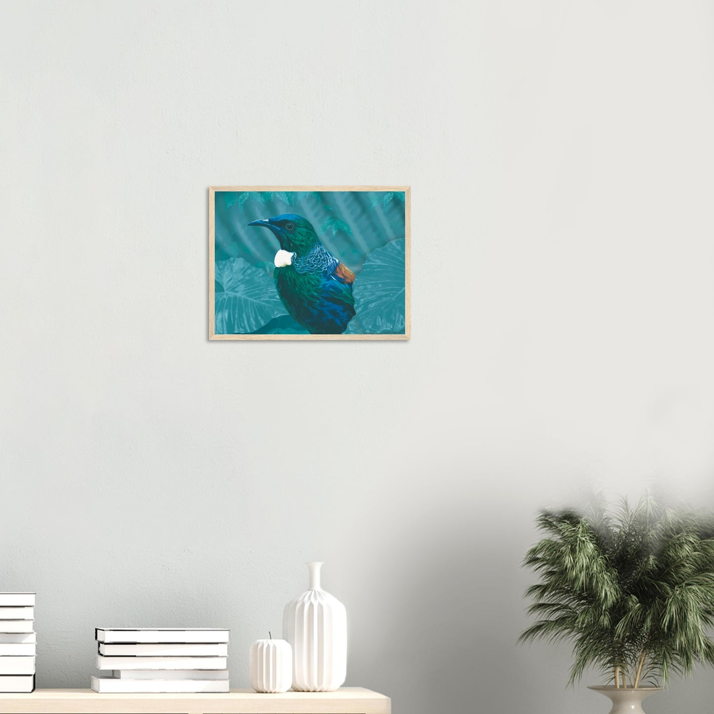 With rich teal and emerald hues and the tūī’s signature white throat tufts, the artwork evokes the dappled light of the forest and the bird’s melodic presence among the trees.