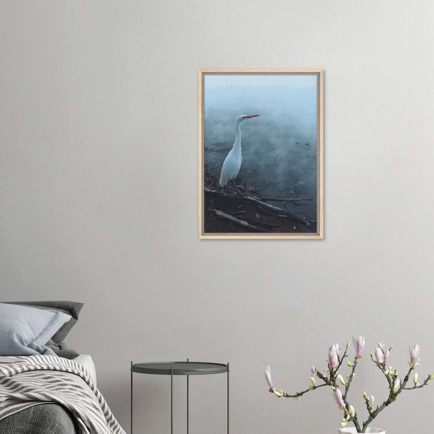 White Heron in the mist captures the quiet elegance of a white heron poised beside mist-covered waters. 