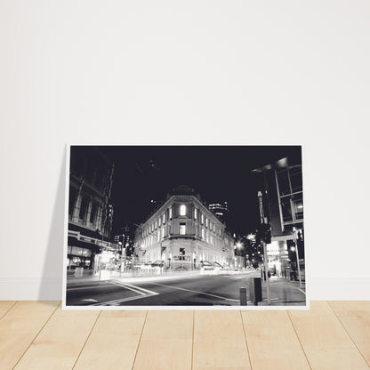 Monochrome artwork of Wellington’s Old Bank Arcade lit up at night, with glowing windows and a classic architectural facade.