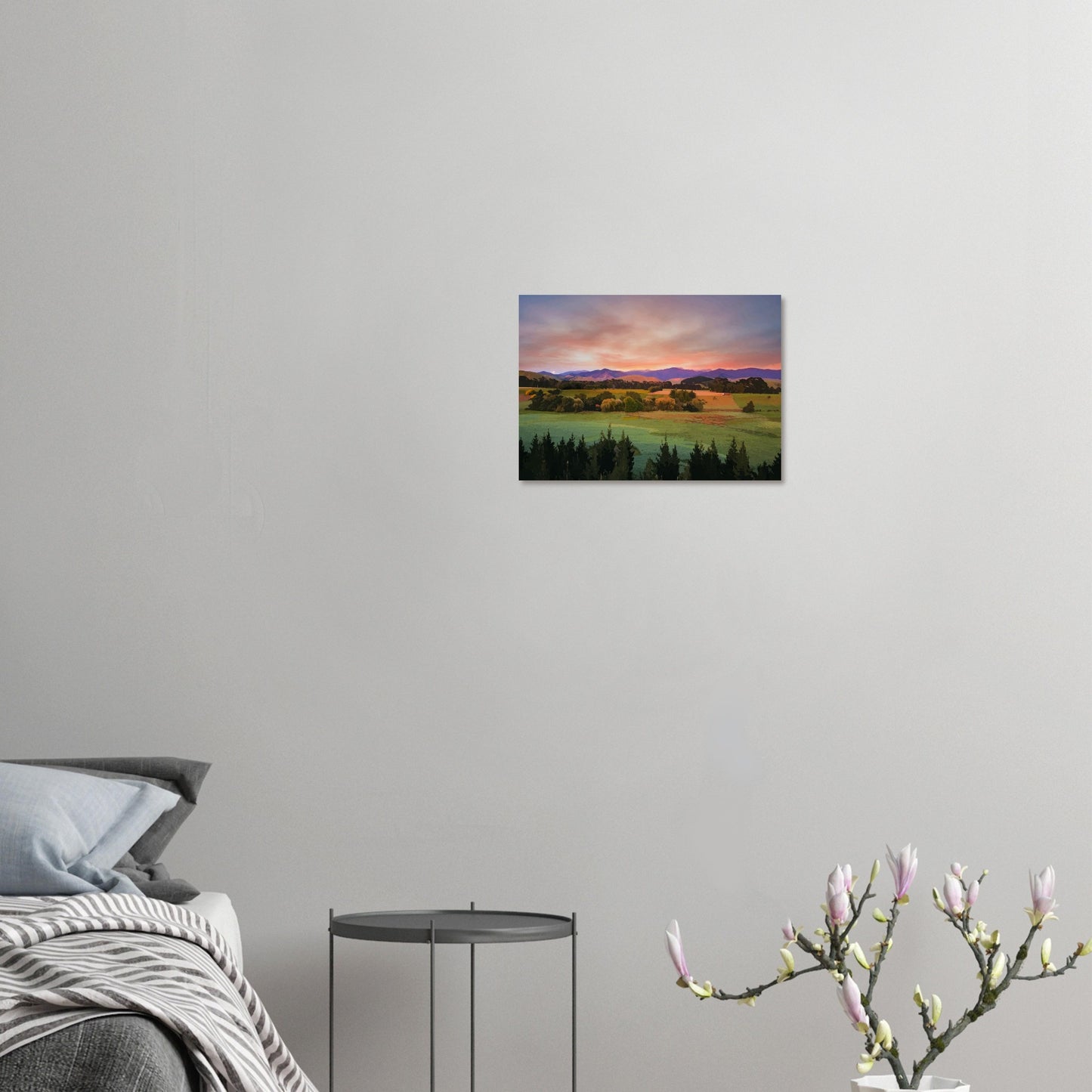 Artwork of a Wairarapa sunrise over pine trees and rolling farmland with soft light on the Tararua Ranges.