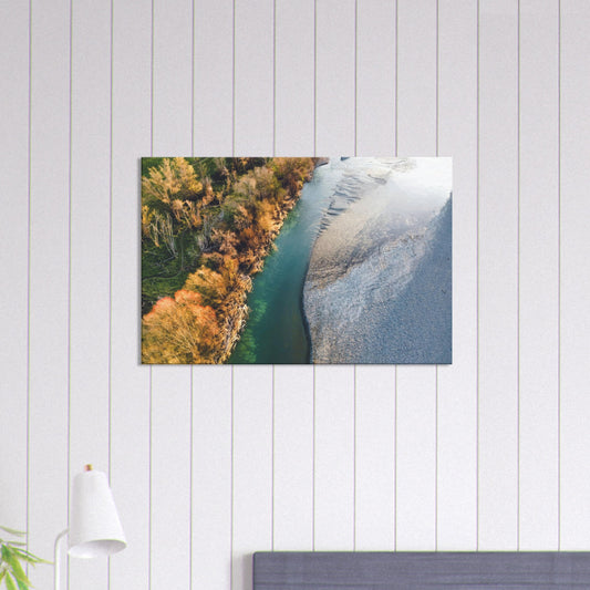 Aerial artwork of a New Zealand river’s edge, with turquoise water, golden trees, and soft shadows.