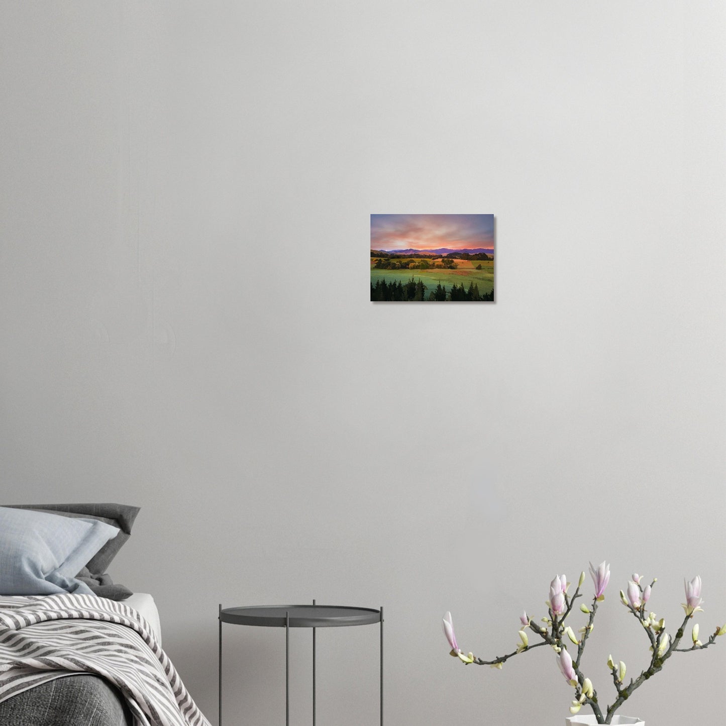 Artwork of a Wairarapa sunrise over pine trees and rolling farmland with soft light on the Tararua Ranges.