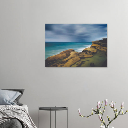 Moody seascape artwork of Castlepoint, with cliffs in the foreground and dark ocean under a brooding sky.