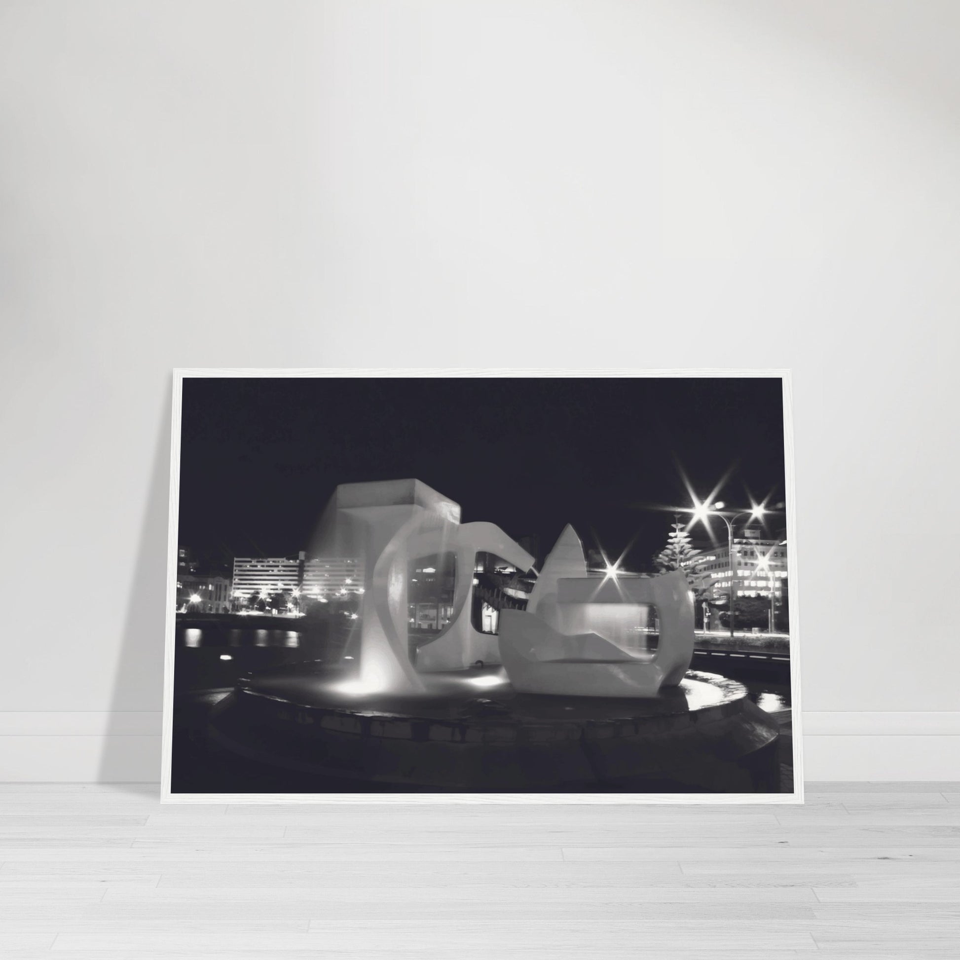Monochrome artwork of Wellington’s Albatross Fountain lit at night, featuring bold sculptural lines and soft lighting.