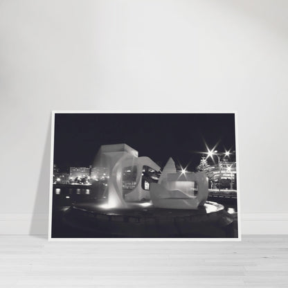 Monochrome artwork of Wellington’s Albatross Fountain lit at night, featuring bold sculptural lines and soft lighting.