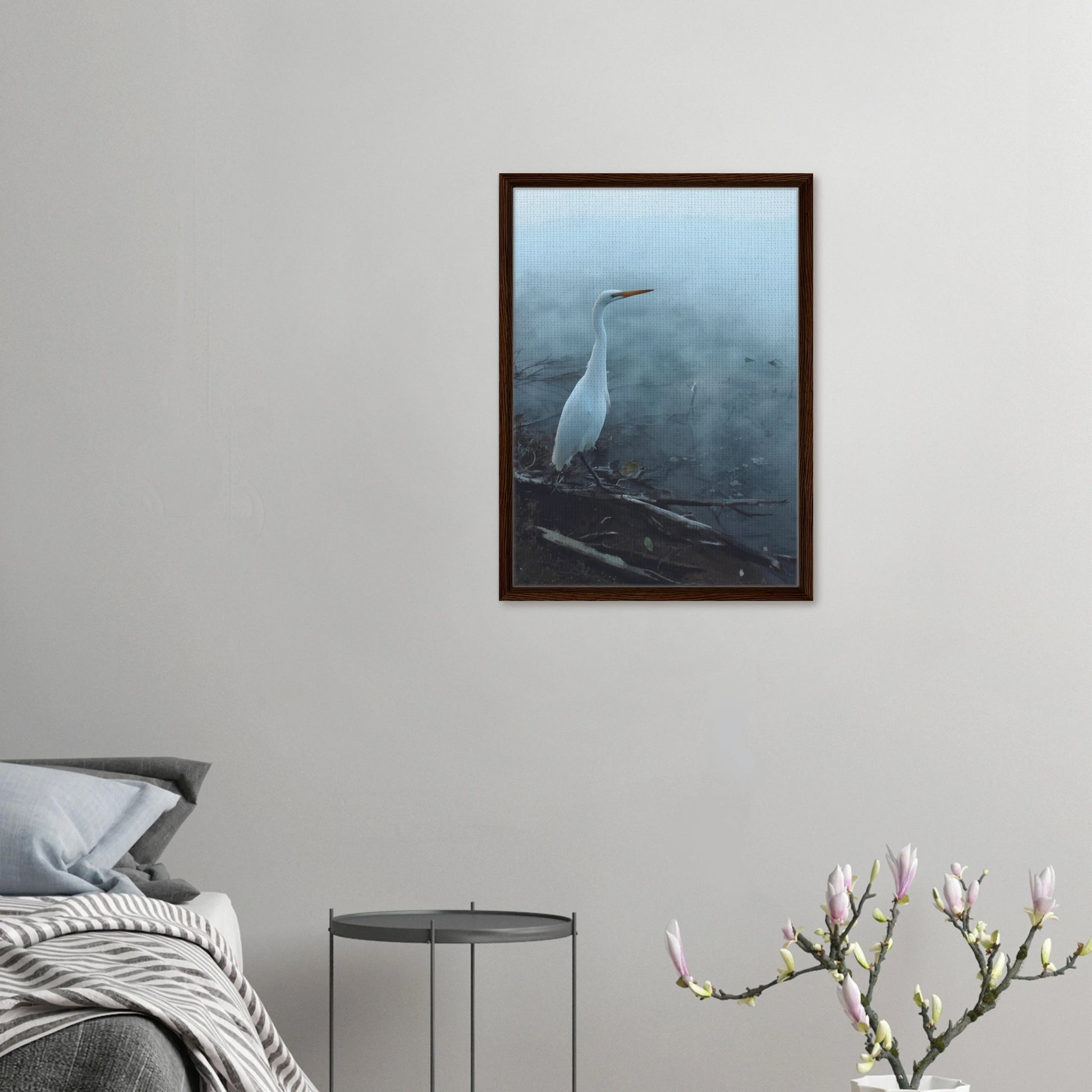 White Heron in the mist captures the quiet elegance of a white heron poised beside mist-covered waters. 