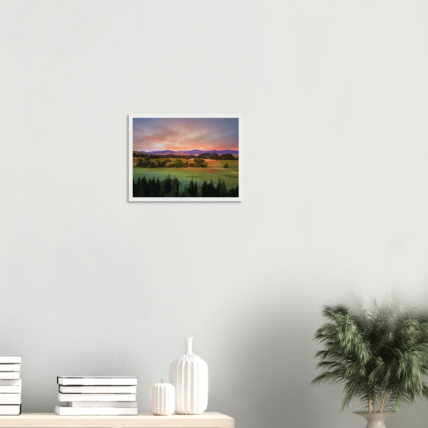Artwork of a Wairarapa sunrise over pine trees and rolling farmland with soft light on the Tararua Ranges.
