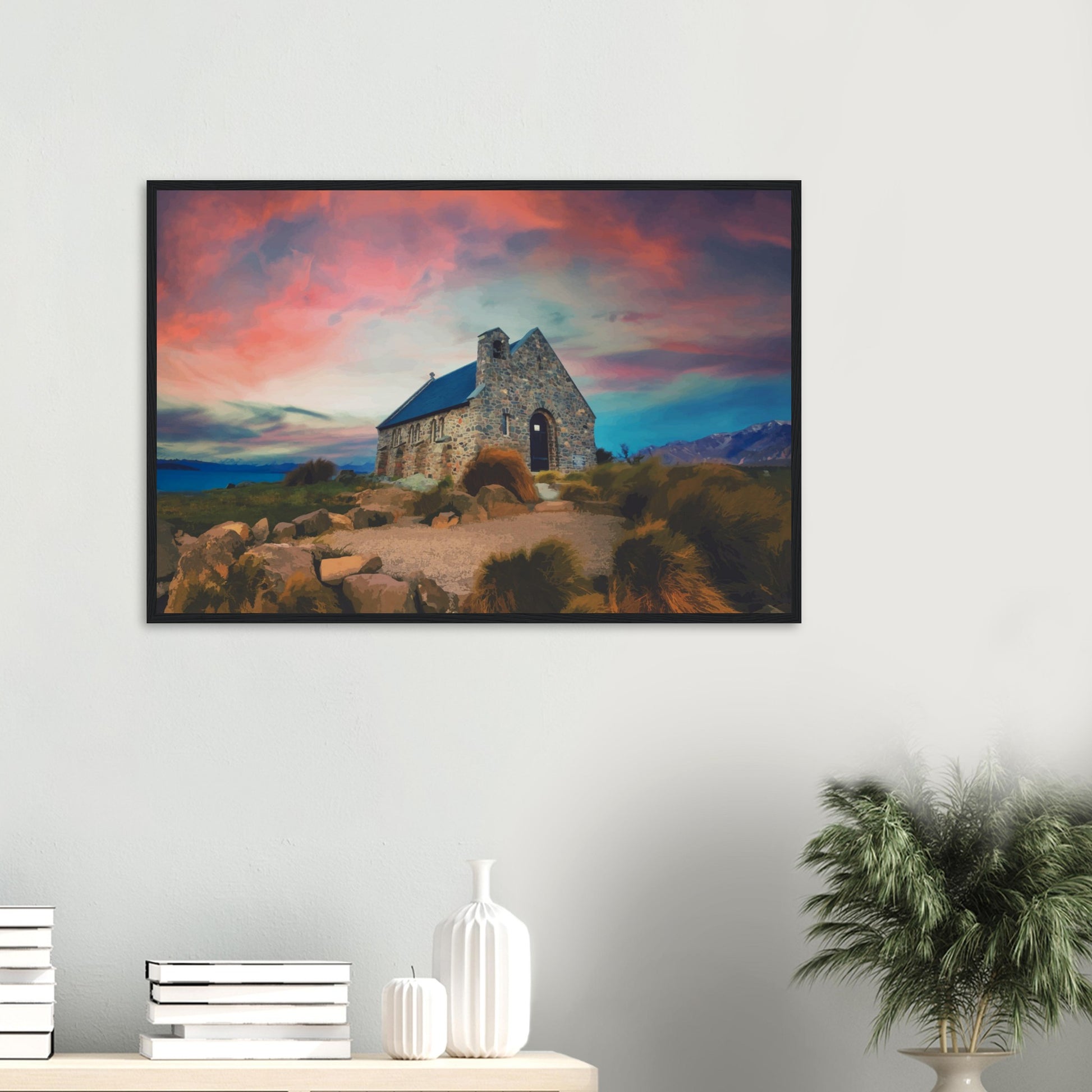 Stone church at Lake Tekapo under a pink and blue sky, with mountains in the background.