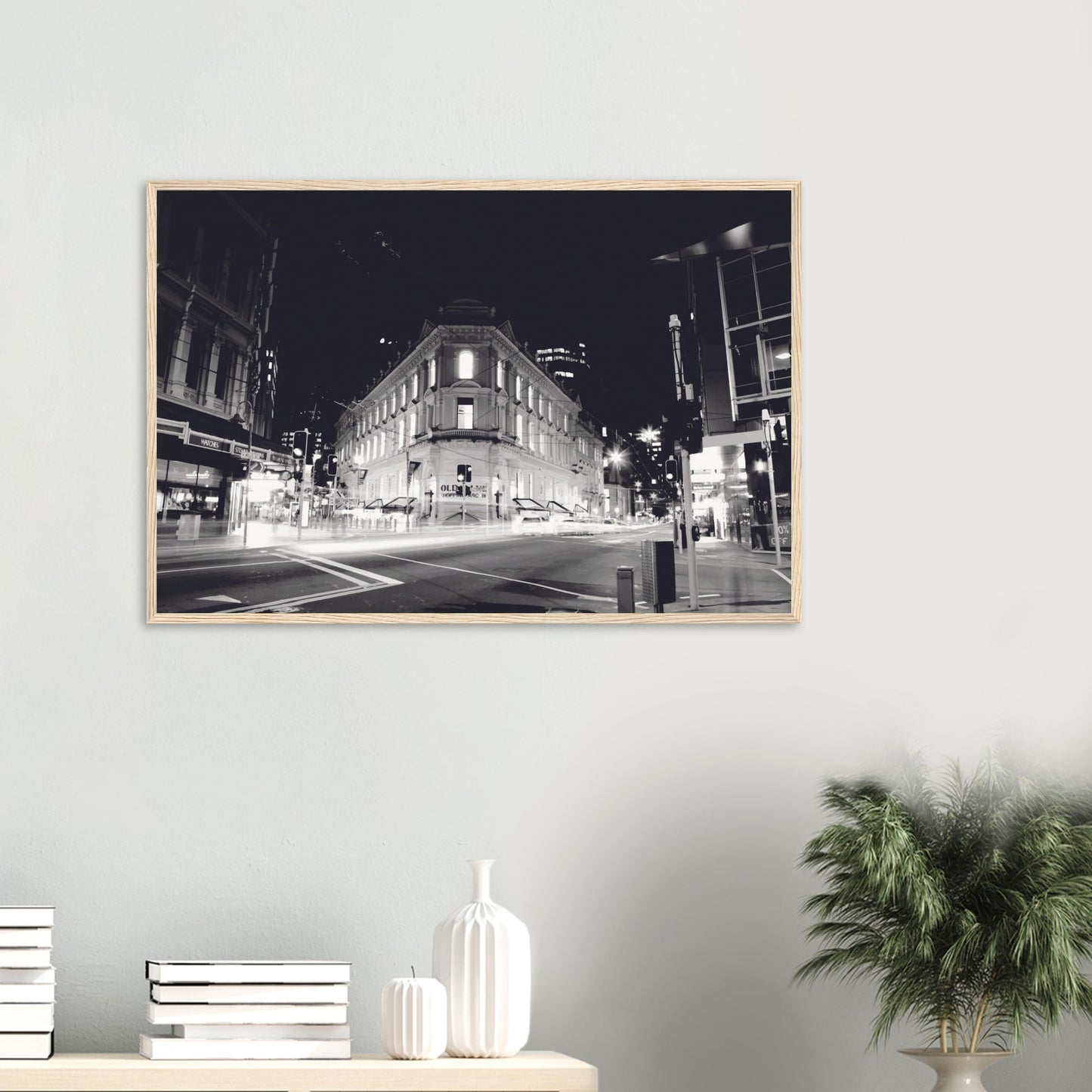 Monochrome artwork of Wellington’s Old Bank Arcade lit up at night, with glowing windows and a classic architectural facade.