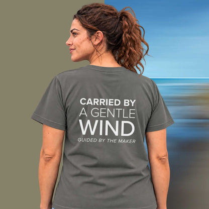 Model wearing the 'Carried by a gentle wind' back print tee in charcoal, large message printed on the back - Blend Designs NZ