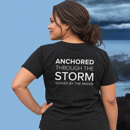 Model wearing the 'Anchored through the storm' back print tee in black, large message printed on the back - Blend Designs NZ