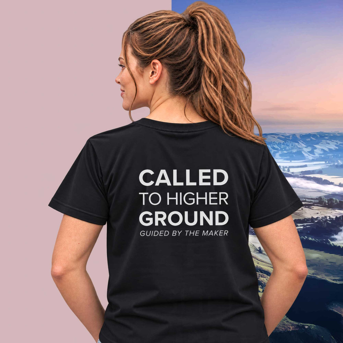Model wearing the 'Called to higher ground' back print tee in black, large message printed on the back - Blend Designs NZ