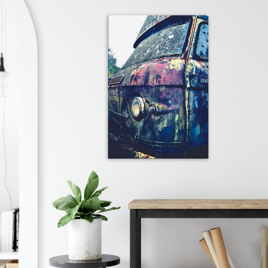 Close-up of a rusted vintage Commer van with textured patina in purple, green and chrome.