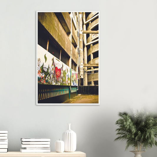 Graffiti-covered alley with concrete walls and fence, full of urban texture and raw colour.