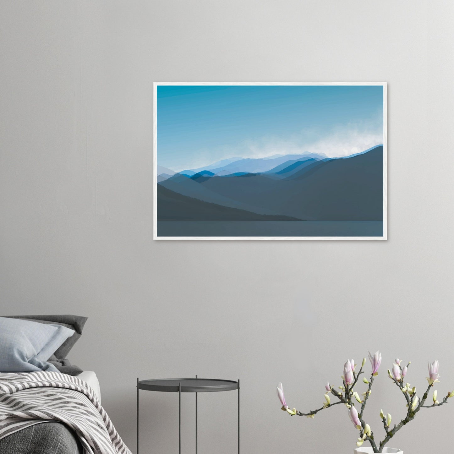 Layered blue mountain ridges fading into mist under a soft sky, evoking calm and simplicity.