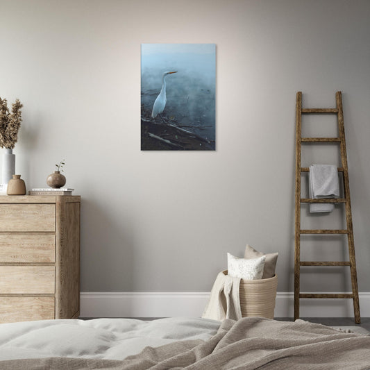 White Heron in the mist captures the quiet elegance of a white heron poised beside mist-covered waters.