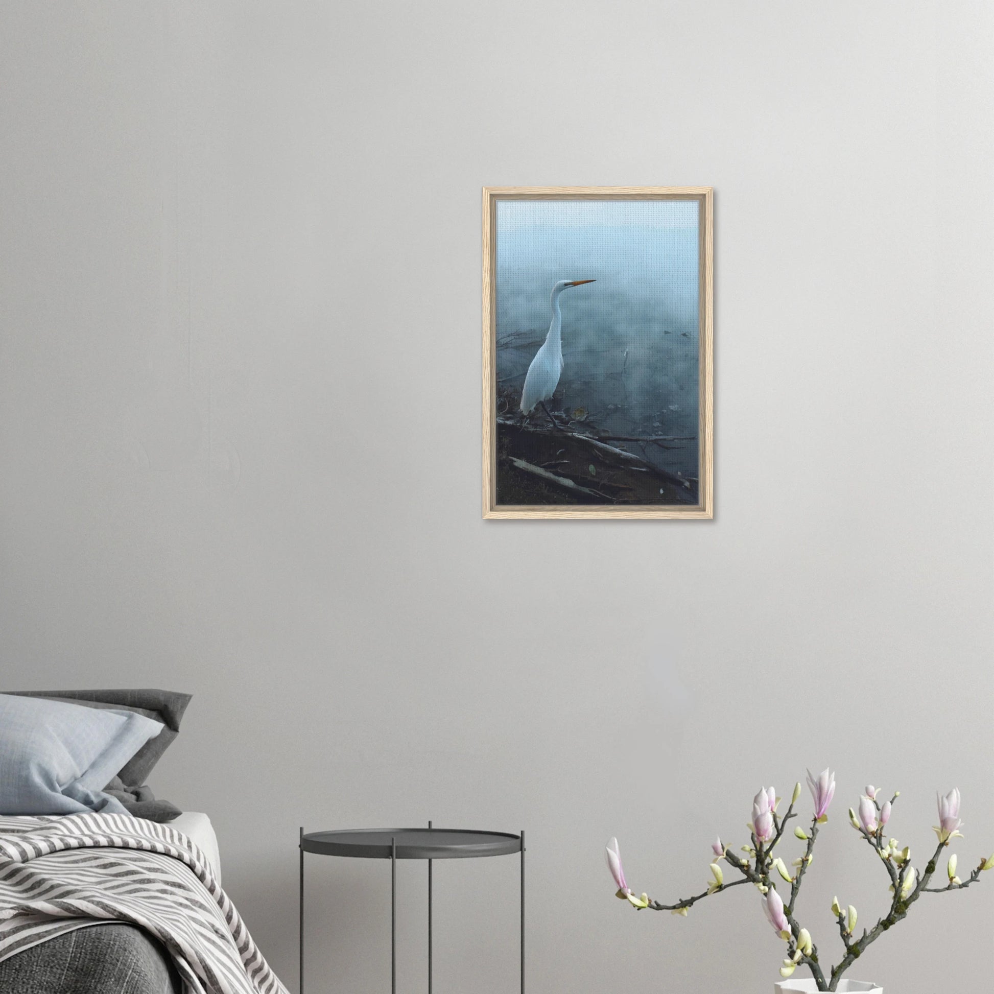 White Heron in the mist captures the quiet elegance of a white heron poised beside mist-covered waters. 