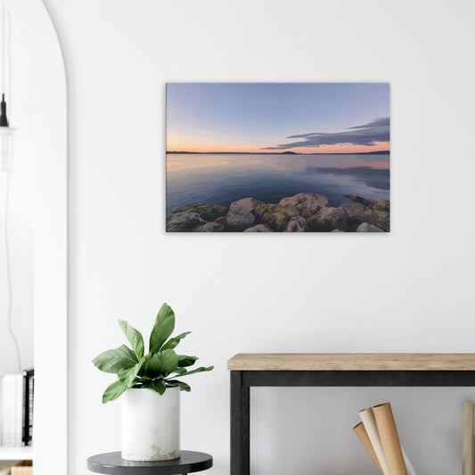 Peaceful Lake Rotorua view with mossy rocks and soft pastel reflections in Calm Waters by NZ artist Ben Hart.