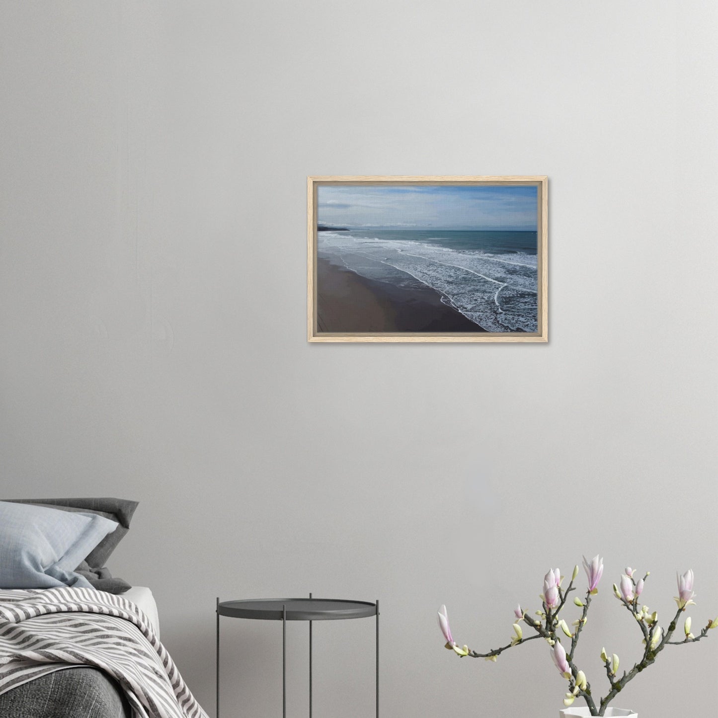 Soft, muted tones of sand, seafoam, and sky blend together in a calming composition, highlighting the natural rhythm of waves lapping the shore.