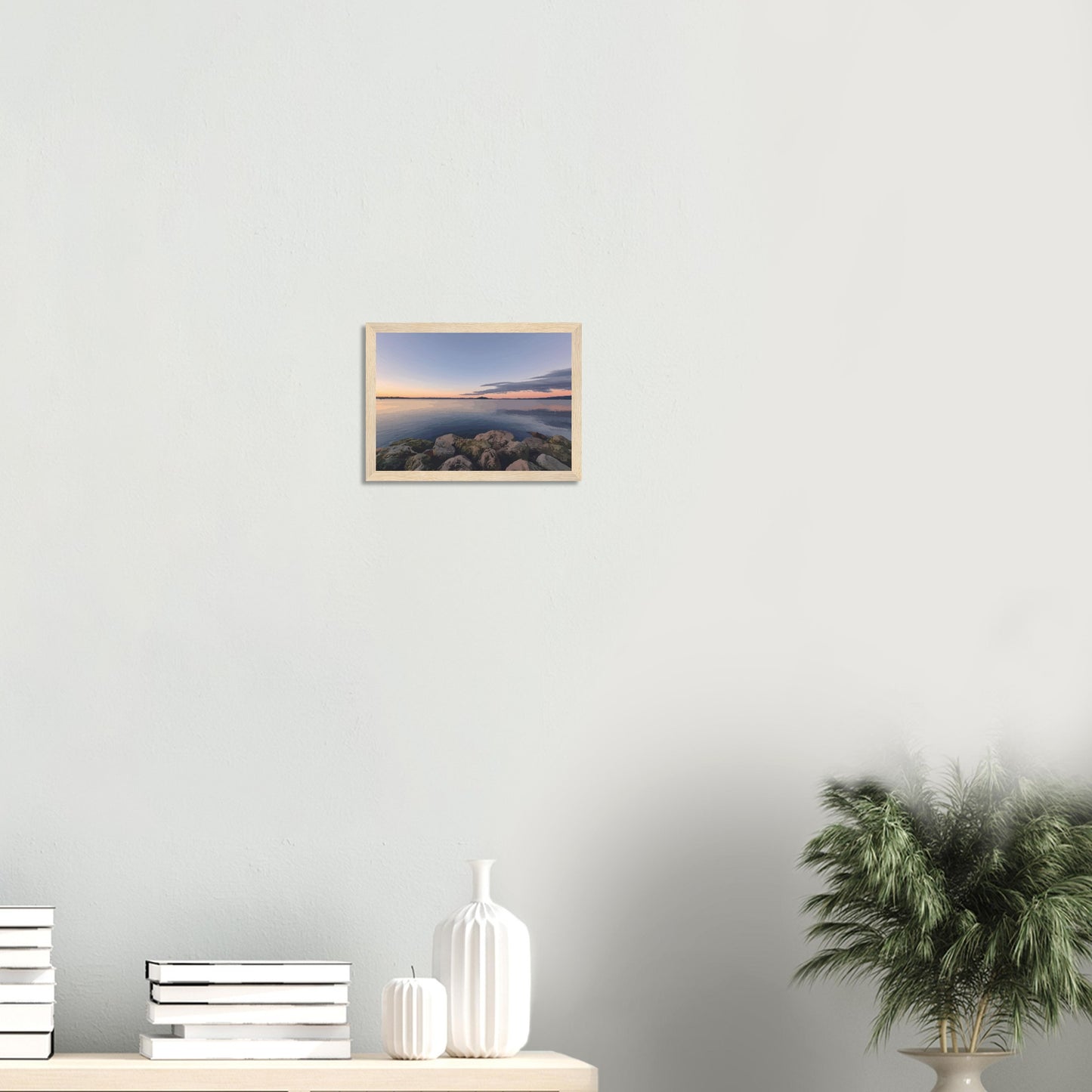 Peaceful Lake Rotorua view with mossy rocks and soft pastel reflections in Calm Waters by NZ artist Ben Hart.