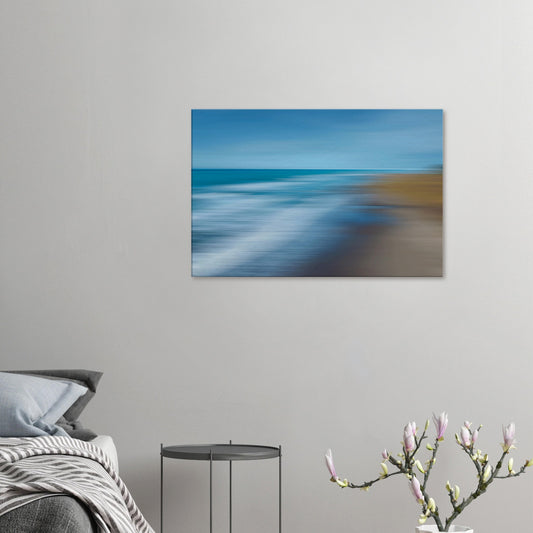 ‘Ocean breeze’ captures the movement of waves and shoreline in a beautifully blurred perspective, creating a dreamlike seascape of blues, teals, and sandy browns.