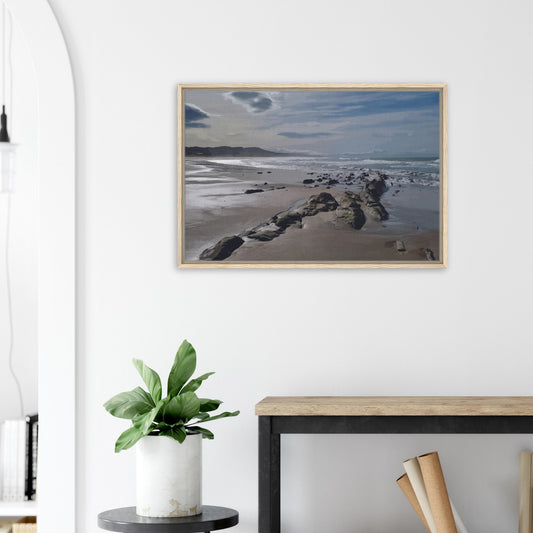 A moody, windswept beach and a line of sea-weathered rocks stretching into the distance, this artwork captures the raw, untouched feel of a wild shoreline.