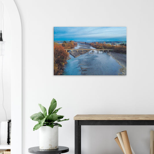 Aerial artwork of bridges crossing the Tuki Tuki River with the Ruahine Ranges in the distance, in cool, calm light.