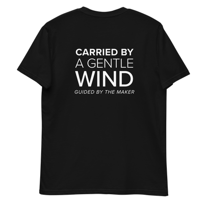 'Carried by a gentle wind' back print tee in black, back view mockup showing the large message print