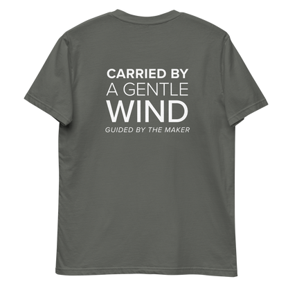 'Carried by a gentle wind' back print tee in charcoal, back view mockup showing the large message print