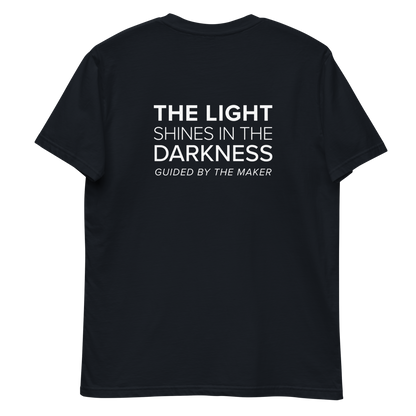 'The light shines in the darkness' back print tee in navy, back view mockup showing the large message print