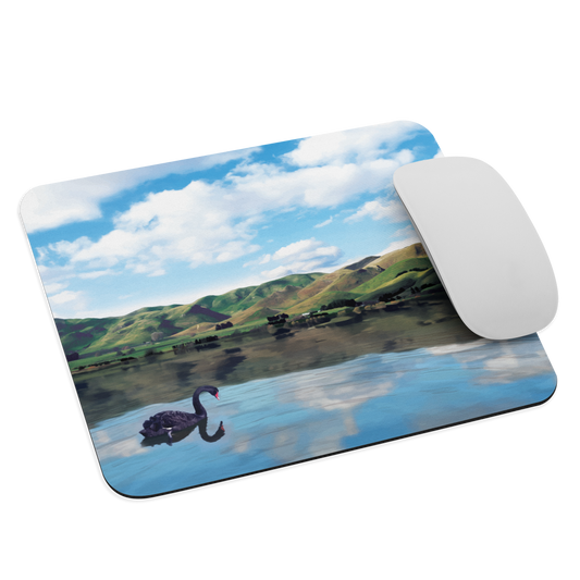 Mouse pad with a black swan on a calm lake, New Zealand hills in the background. Art by NZ designer Ben Hart.