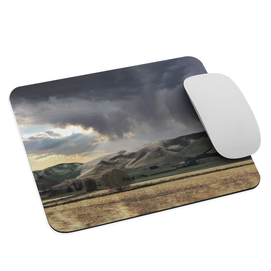 Designer mouse pad with NZ landscape painting of Te Hauke and cloudy skies by Ben Hart.