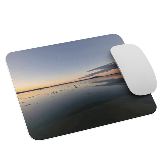 Mouse pad with tranquil lake scene at sunrise and distant hills.