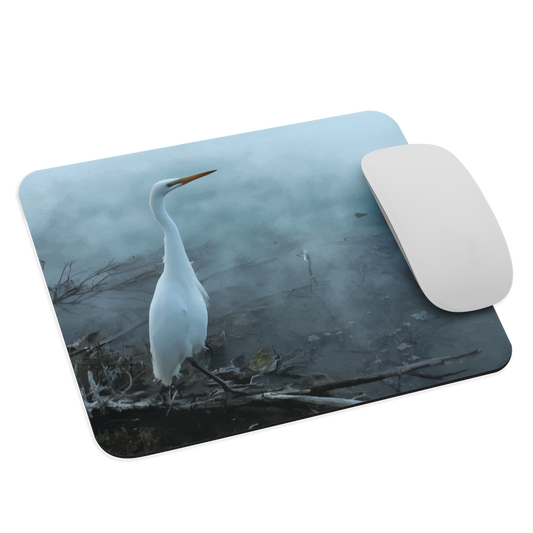 Mouse pad with a white heron standing in a misty wetland scene.