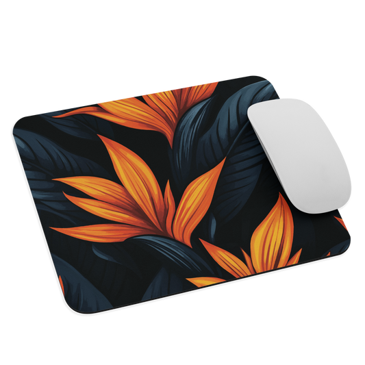 Mouse pad with bold orange bird of paradise flowers on dark background.