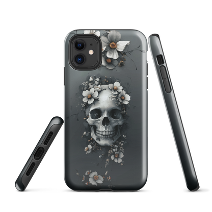 Gothic phone case with a floral skull design in grey tones, featuring white blossoms and dark detailing.