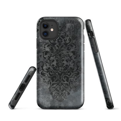 Dark damask patterned phone case with a vintage gothic aesthetic and textured stone background.