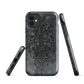 Dark damask patterned phone case with a vintage gothic aesthetic and textured stone background.